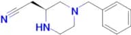 (S)-2-(4-Benzylpiperazin-2-yl)acetonitrile