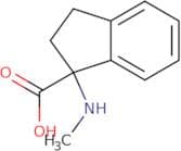 1-(Methylamino)-2,3-dihydro-1H-indene-1-carboxylic acid