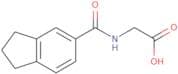 2-(2,3-Dihydro-1H-inden-5-ylformamido)acetic acid