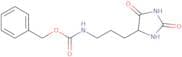 Benzyl N-[3-(2,5-dioxoimidazolidin-4-yl)propyl]carbamate