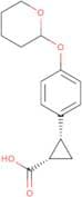 trans-2-[4-(Oxan-2-yloxy)phenyl]cyclopropane-1-carboxylic acid