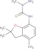 (aminomethylamino)((2,2,7-trimethyl(3-oxaindan-4-yl))amino)methane-1-thione