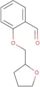 2-[(Oxolan-2-yl)methoxy]benzaldehyde