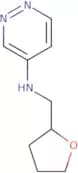 N-[(Oxolan-2-yl)methyl]pyridazin-4-amine