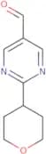 2-(Oxan-4-yl)pyrimidine-5-carbaldehyde