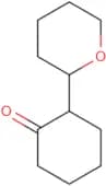 2-(Oxan-2-yl)cyclohexan-1-one