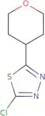 2-Chloro-5-(oxan-4-yl)-1,3,4-thiadiazole