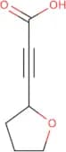 3-(Oxolan-2-yl)prop-2-ynoic acid