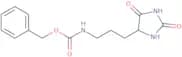 Benzyl N-[3-(2,5-dioxoimidazolidin-4-yl)propyl]carbamate
