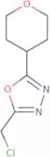 2-(Chloromethyl)-5-(oxan-4-yl)-1,3,4-oxadiazole