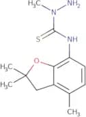 (aminomethylamino)((2,2,7-trimethyl(3-oxaindan-4-yl))amino)methane-1-thione