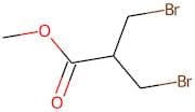 Methyl 3-bromo-2-(bromomethyl)propanoate