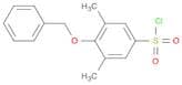 4-(Benzyloxy)-3,5-dimethylbenzene-1-sulfonyl chloride