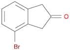 4-BROMO-2-INDANONE