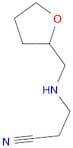 3-(((Tetrahydrofuran-2-yl)methyl)amino)propanenitrile