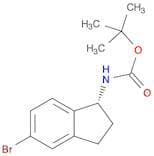 Carbamic acid, [(1R)-5-bromo-2,3-dihydro-1H-inden-1-yl]-, 1,1-dimethylethyl ester (9CI)