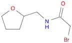 2-Bromo-N-(tetrahydro-2-furanylmethyl)acetamide