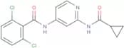 2,6-Dichloro-N-(2-(cyclopropanecarboxamido)pyridin-4-yl)benzamide