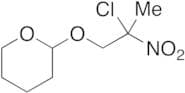 2-(2-Chloro-2-nitropropoxy)tetrahydro-2H-pyran